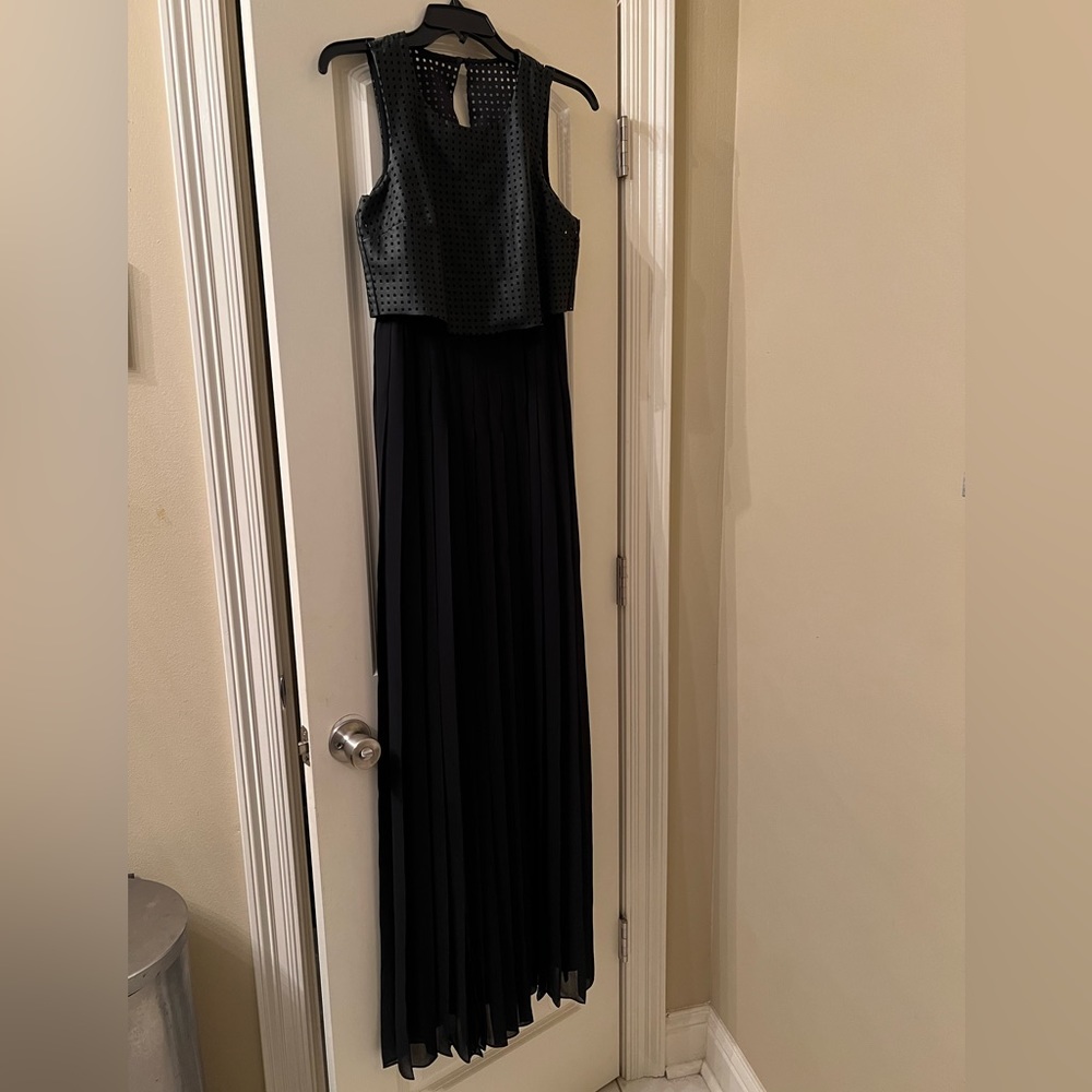 Black bcbg long pleated dress. Has a faux leather top